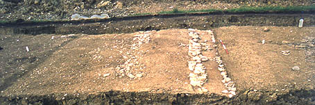 Area 3, the stone wall and berm excavated.