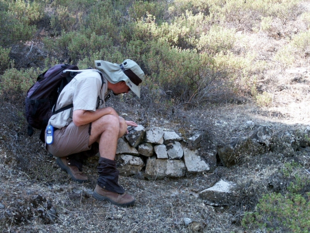 Figure 36: Nikitari Stavros check dam (TS19), with geomorphologist Jay Noller. Photograph: Michael Given. 