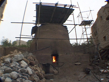 Image of firing the kiln.
