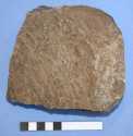 Fragment of Lodsworth Greensand quernstone