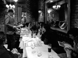 B&W Photo of people having dinner and drinking
