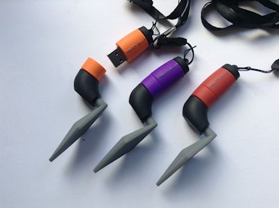 A row of coloured USB trowels