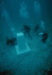 Photograph of the monument containing the 1986 skeletal material being placed at the wreck site in 1993