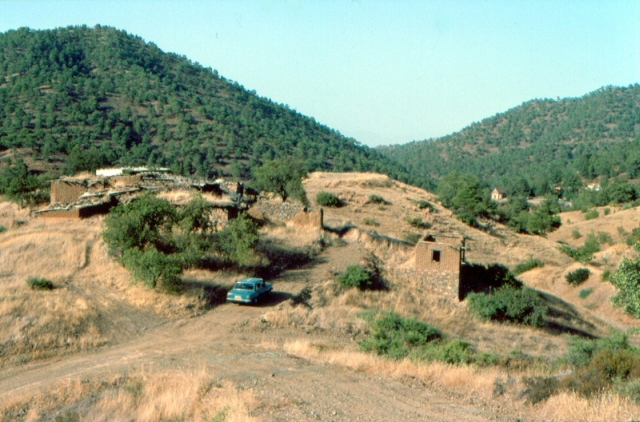 Figure 37: Asinou settlement (TS03) from the south-west, with Panayia Phorviotissa in the background to the right. Photograph: Chris Parks. 