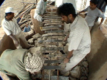 Image of loading the kiln with limestone.