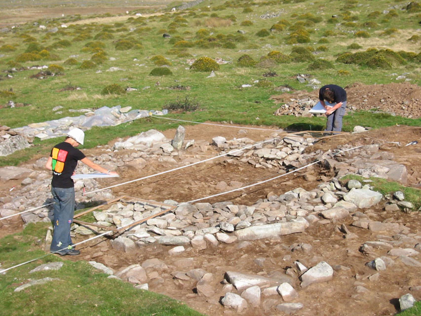 A small upland roundhouse being excavated