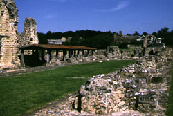 Remains of St. Augustine's Abbey, Canterbury, with the remains of the Church of Saints Peter and Paul (left, under the roof) and the Church of St. Pancras (right rear).