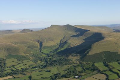 View of the Brecon Beacons upland landscape in south Wales showing the present-day open landscape on the summit with improved land and woodland on the lower slopes. (Image: T. Driver, Crown Copyright RCAHMW, AP-2007_2737)