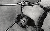 Aerial photograph of Llangan Church showing the crop-mark of the Iron Age enclosure. Note the circular enclosure to the top of the photograph, probably an earlier prehistoric site