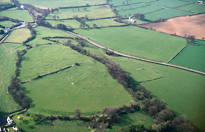 Within the ramparts of Caer Dynnaf are the extensive earthworks that mark the Roman settlement, which seems to have consisted of small farmsteads set in a system of small enclosures that probably include paddocks and garden (Image: Crown Copyright RCAHMW)