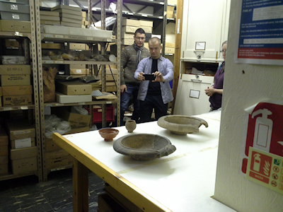 Ivan Tyukin and Konstantin Sofeikov using I-phones to scan Roman ceramics in the Jewry Wall Museum. (Photo P. Allison)