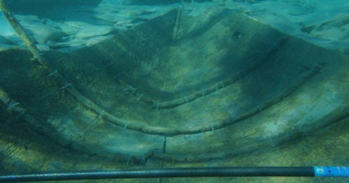 The front half of a shipwreck of a small boat
