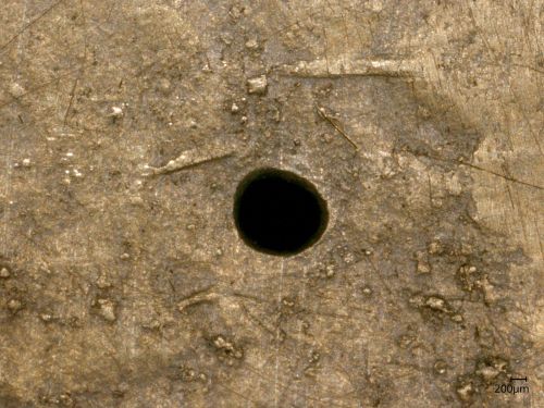 Close up colour photograph of central hole