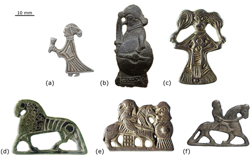 A grid of six 'Valkyrie' pendants/mounts and horse-shaped brooches with a scale bar at the top left showing 10 mm.
(a) A standing human figure, possibly female, with a pointed cap and long dress, holding an object that resembles a cup or horn in one hand.
(b) A standing human figure holding a shield and a spear or staff, with a helmet or elaborate headdress.
(c) A stylized human figure with an elaborate, possibly horned or winged, headdress, and intricate patterns on the body, which tapers downwards.
(d) A horse-shaped brooch with incised lines on its body, standing on four legs.
(e) Two figures on horseback, facing each other, possibly representing warriors, with detailed armor or clothing.
(f) A single rider on horseback, with the horse in a dynamic pose.